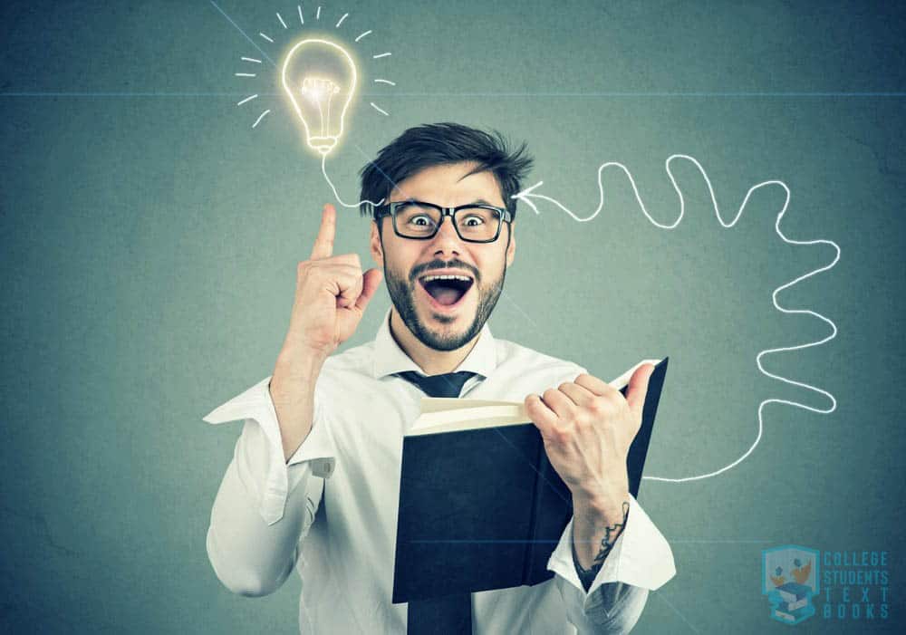 Young man wearing glasses and holding a book gets an idea (a bulb lightens up over his head)
